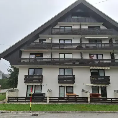 an apartment building with balconies on the side of it at Bohinj Planika J2 in Bohinj