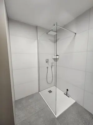 a bathroom with a shower with a glass door at Modern apartment Konjice in Slovenske Konjice