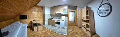 a small kitchen with a bed in a room at Suita 305 in Kranjska Gora