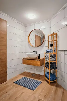 a bathroom with a sink and a mirror at Hiška pri Paulu in Dobrovnik