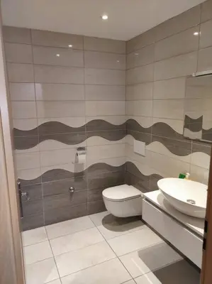 a bathroom with a toilet and a sink at Spacious Countryside Flat - 25 minutes from Ljubljana in Grosuplje