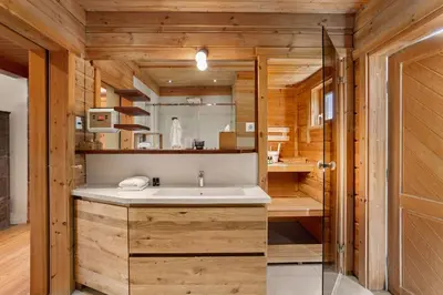 a bathroom with a sink and a shower at Wellness Chalet close to Ljubljana in Rakitna