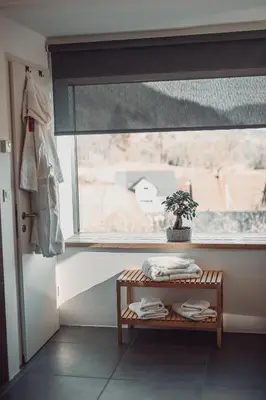 a window in a room with a table and a plant at eco boutique hotel AMS Beagle in Bled