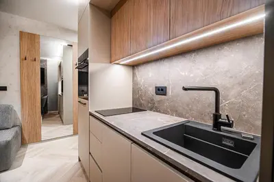 a kitchen with a sink and a counter at Apartment Gorski Raj in Kranjska Gora