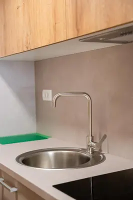 a stainless steel sink in a kitchen at Hiša S'TJE Krvavec ski resort in Cerklje na Gorenjskem