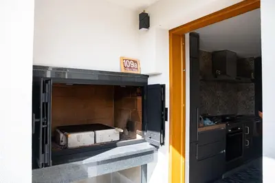 a kitchen with a pizza oven in the wall at Zidanica sredi dolenjskih gričev - V gaj in Trebnje