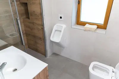 a bathroom with a toilet and a sink and a shower at Zidanica sredi dolenjskih gričev - V gaj in Trebnje