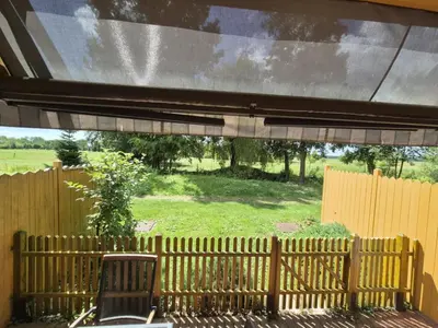 a view of a backyard from a patio at Marjetica 40 in Moravske Toplice