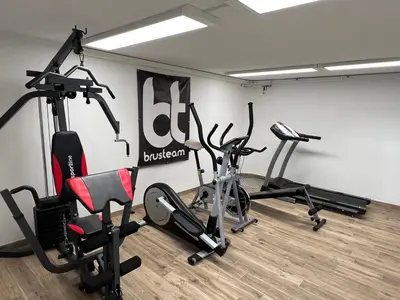 a gym with several exercise bikes in a room at Luxury House Ledine in Spodnja Idrija