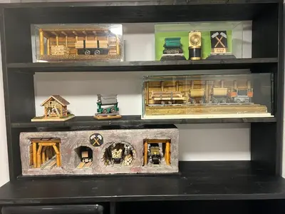 a shelf filled with lots of different types of toys at Luxury House Ledine in Spodnja Idrija