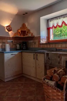 a kitchen with a counter top and a window at Holiday house Pokrovec - Bohinj in Bohinj
