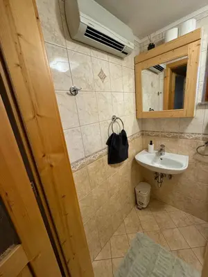 a bathroom with a sink and a mirror at Holiday house Pokrovec - Bohinj in Bohinj