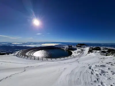 a snow covered amphitheater on top of a mountain at Apartma Maya in Cerklje na Gorenjskem
