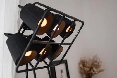 a black traffic light hanging from a wall at A modern flat in Kranjska Gora