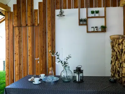 a table with a vase on top of it at A modern flat in Kranjska Gora