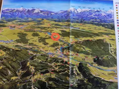 a map of a city with mountains in the background at Mini wellness studio-near the airport in Smlednik