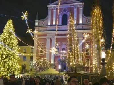 a large building with christmas lights in front of it at mobile house Rest Area in Ljubljana