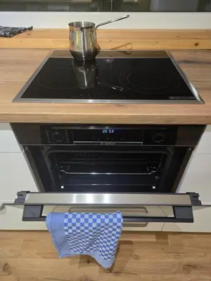 a stove top oven with a pot on top of it at Agregat in Ljubljana