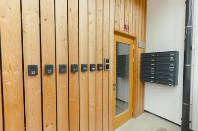 a row of wooden lockers in a building at Nordic House Apartment A1 in Kranjska Gora