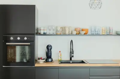 a kitchen with a sink and a microwave at Nordic House Apartment A1 in Kranjska Gora