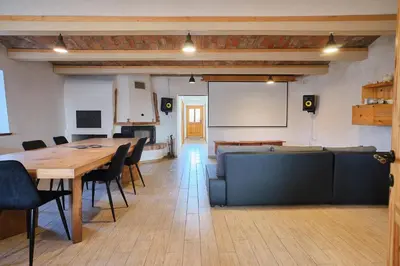 a conference room with a table and chairs and a board at Hisa na Zlatem polju in Lukovica pri Domžalah