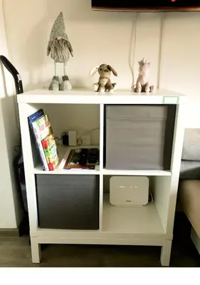 a white shelf with two stuffed animals on it at Apartment Misty Forest in Kranjska Gora