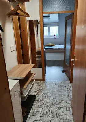 a room with a room with a bed and a door at Apartment Misty Forest in Kranjska Gora