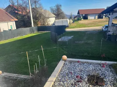 a garden with a piano in the middle of a yard at Kmečka Vila in Višnja Gora