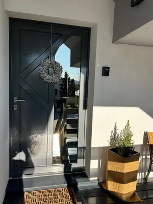 a black front door with a wreath on it at Cozy stay near Bled in Radovljica