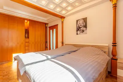 a bedroom with a large bed in a room at Apartma Apolon I in Krško