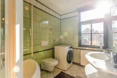 a bathroom with a toilet and a sink at Apartma Apolon I in Krško