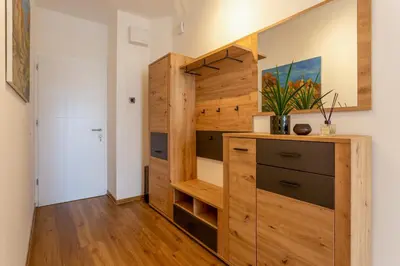 a room with a closet with a wooden cabinet at Apartma Apolon II in Krško