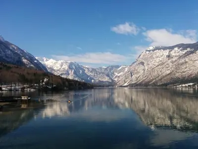 a view of a lake with snow covered mountains at Bohinj Jeglič C17 in Bohinj