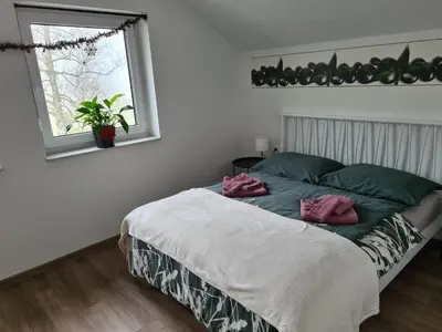 a bedroom with a bed and a window at Maya-K apartment near city center in Ljubljana