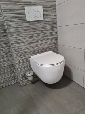 a bathroom with a white toilet in a room at Maya-K apartment near city center in Ljubljana