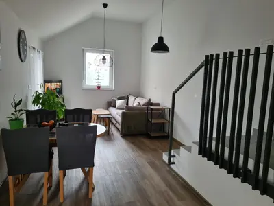 a living room with a table and a couch at Maya-K apartment near city center in Ljubljana