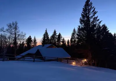 a tent in the snow at night at Gorska koča Krvavec in Cerklje na Gorenjskem