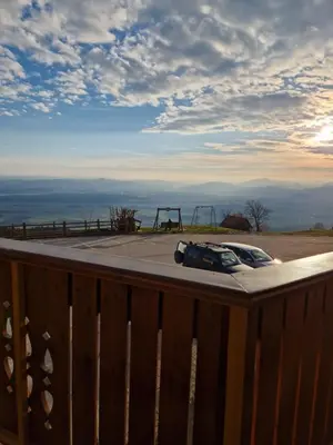 a car parked on a deck with a playground at Apartmaji Pr Ambružarju in Cerklje na Gorenjskem