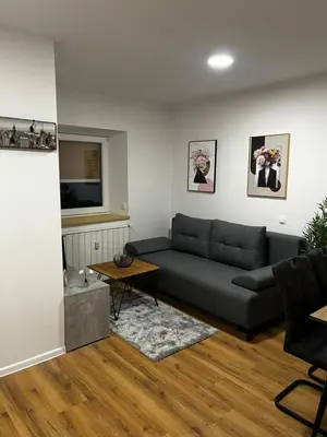 a living room with a couch and a table at Apartmaji MAS 2 in Ljubljana