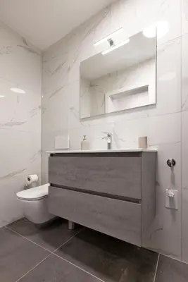 a bathroom with a sink and a toilet at Apartments Napoleon in Ljubljana
