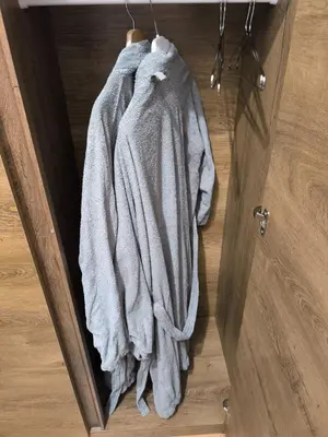 a towel hanging from a door in a room at Apartma Dian in Mostec