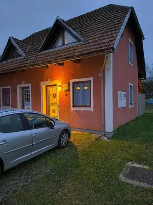 a car parked in front of a house at Apartma Dian in Mostec