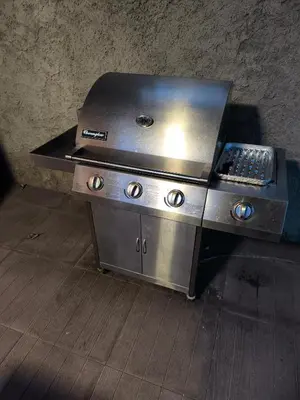 a kitchen with a grill in a room at Apartma Dian in Mostec