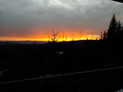 a sunset on a hill with a train track at Apartma Escales -naselje Nune-Rogla in Zreče