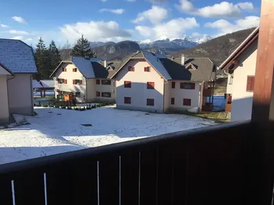 a view from a balcony of a group of houses at Apartment Happy Place in Bohinj