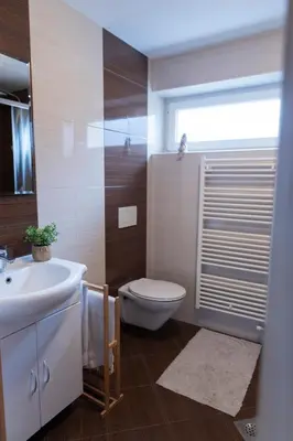 a bathroom with a toilet and a sink at Lazy Haven in Moravske Toplice