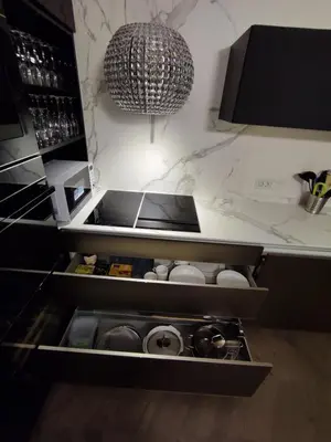 a kitchen with a sink and a chandelier at Downtown appartment with a view in Ljubljana