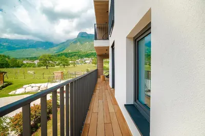 a balcony with a view of a mountain at Family apartments Soča Splash Home in Bovec