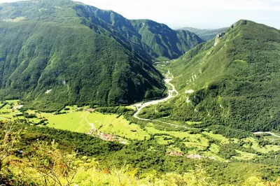 a view of a valley in the mountains at Apartment Pri Bricu in Kobarid