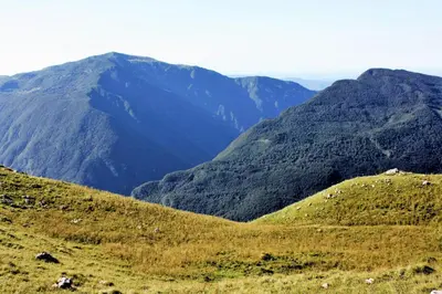 a view of a mountain range with mountains in the background at Apartment Pri Bricu in Kobarid